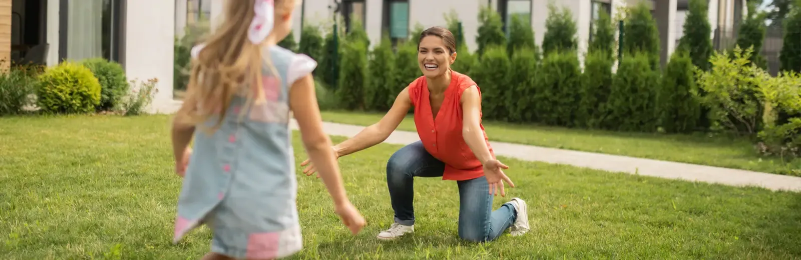 mother and daughter playing in mosquito free yard